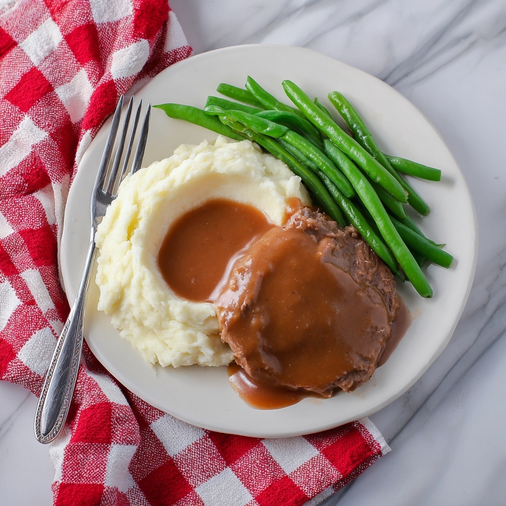 Crock Pot Cube Steak with Rich Onion Gravy Recipe - Recipe Image